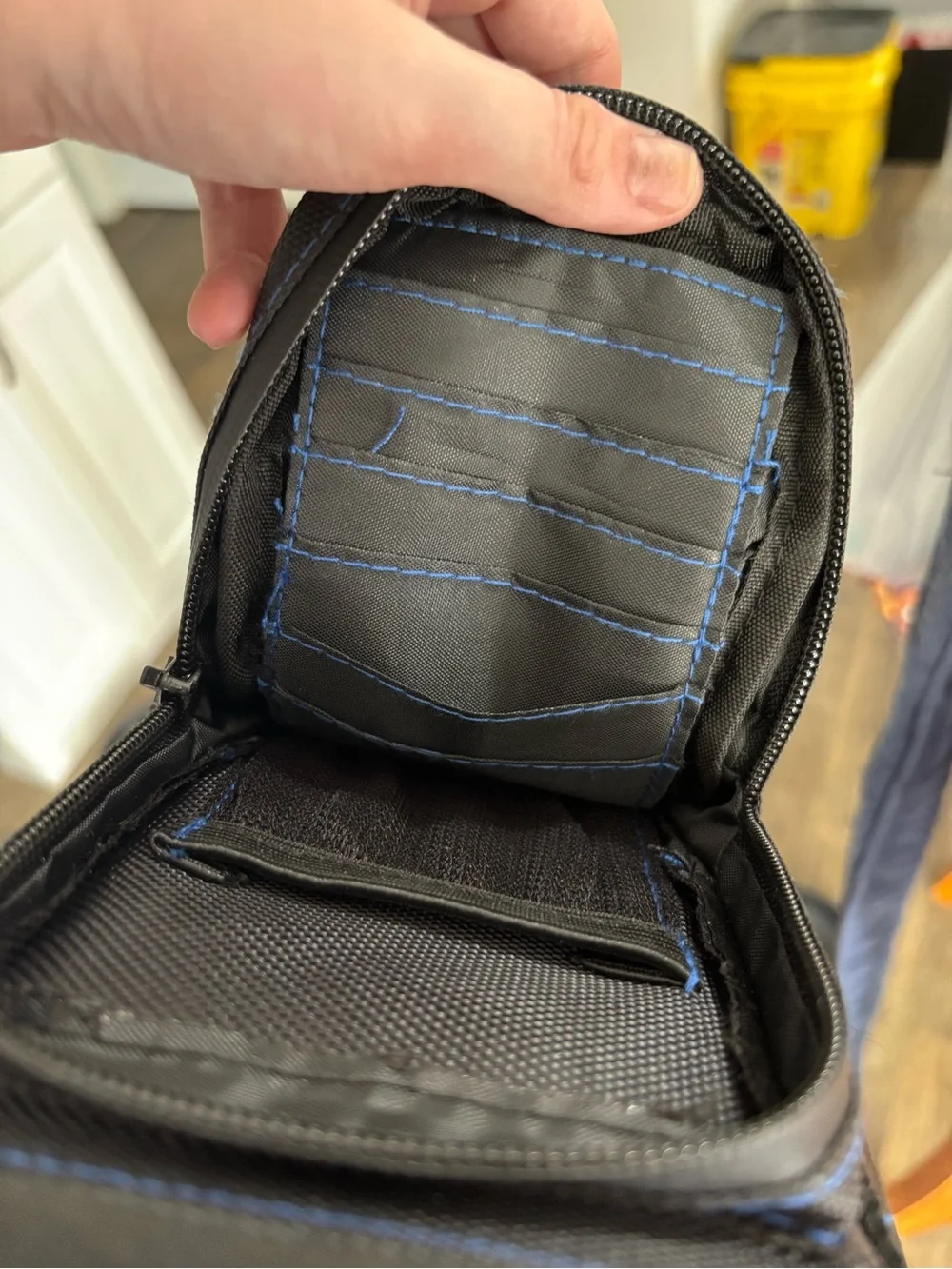 Black and blue water bottle crossbody